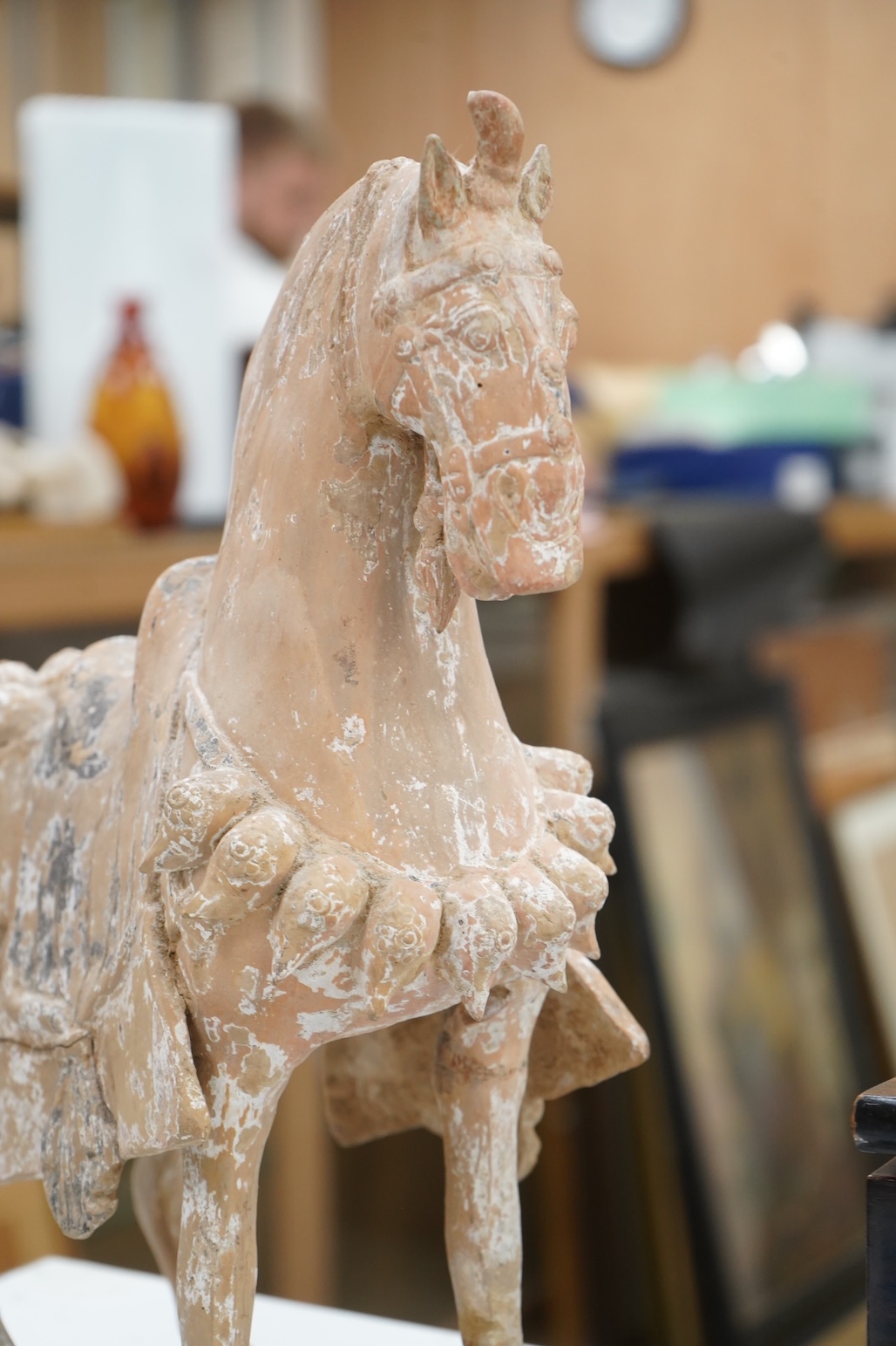 A Chinese pottery figure of a horse, Tang dynasty or later, 40cm high